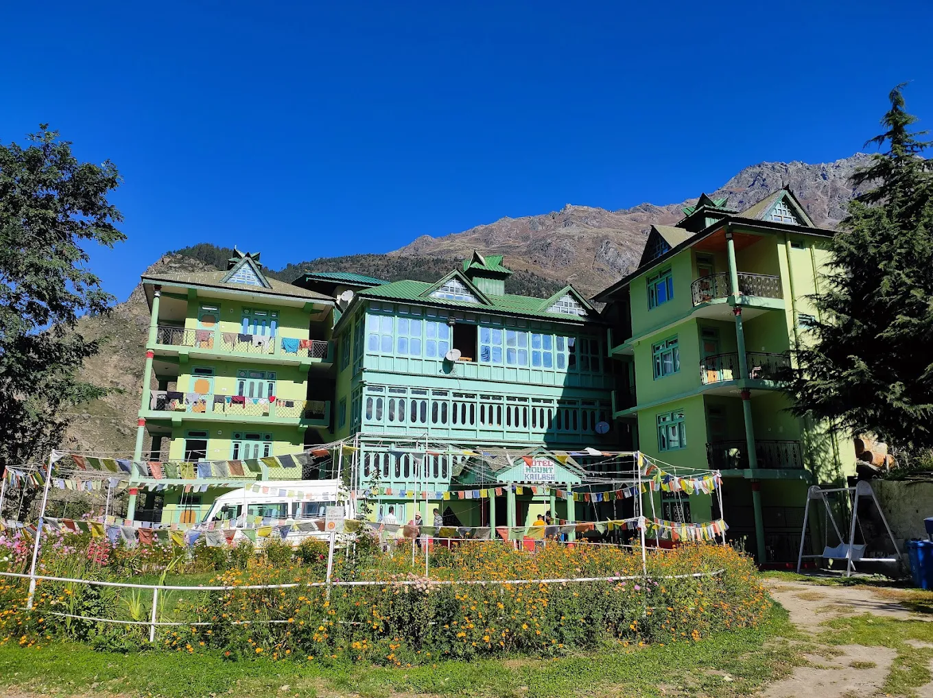 Hotel Mount Kailash exterior view with mountains